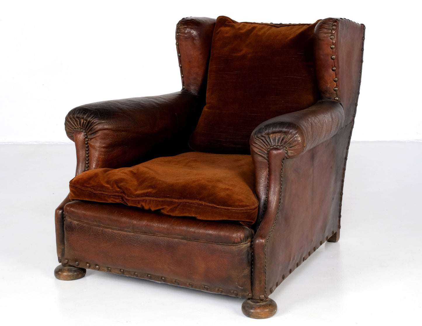 LEATHER AND VELVET LOUNGE ARMCHAIR