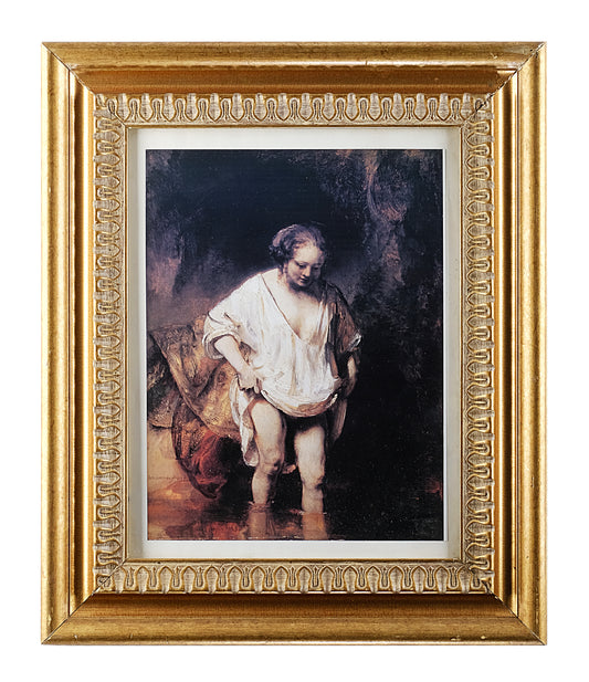 A WOMAN BATHING IN A STREAM